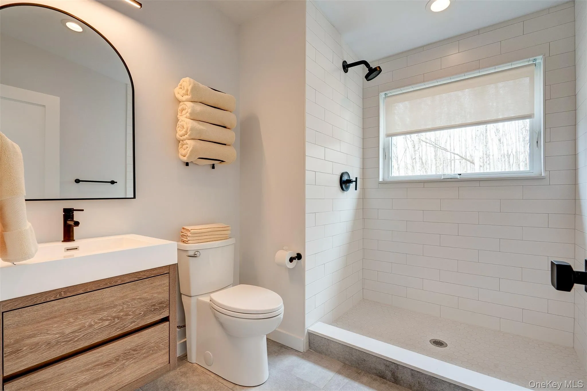 Full bathroom with vanity, a stall shower, and recessed lighting Full bathroom with vanity, a stall shower, and recessed lighting