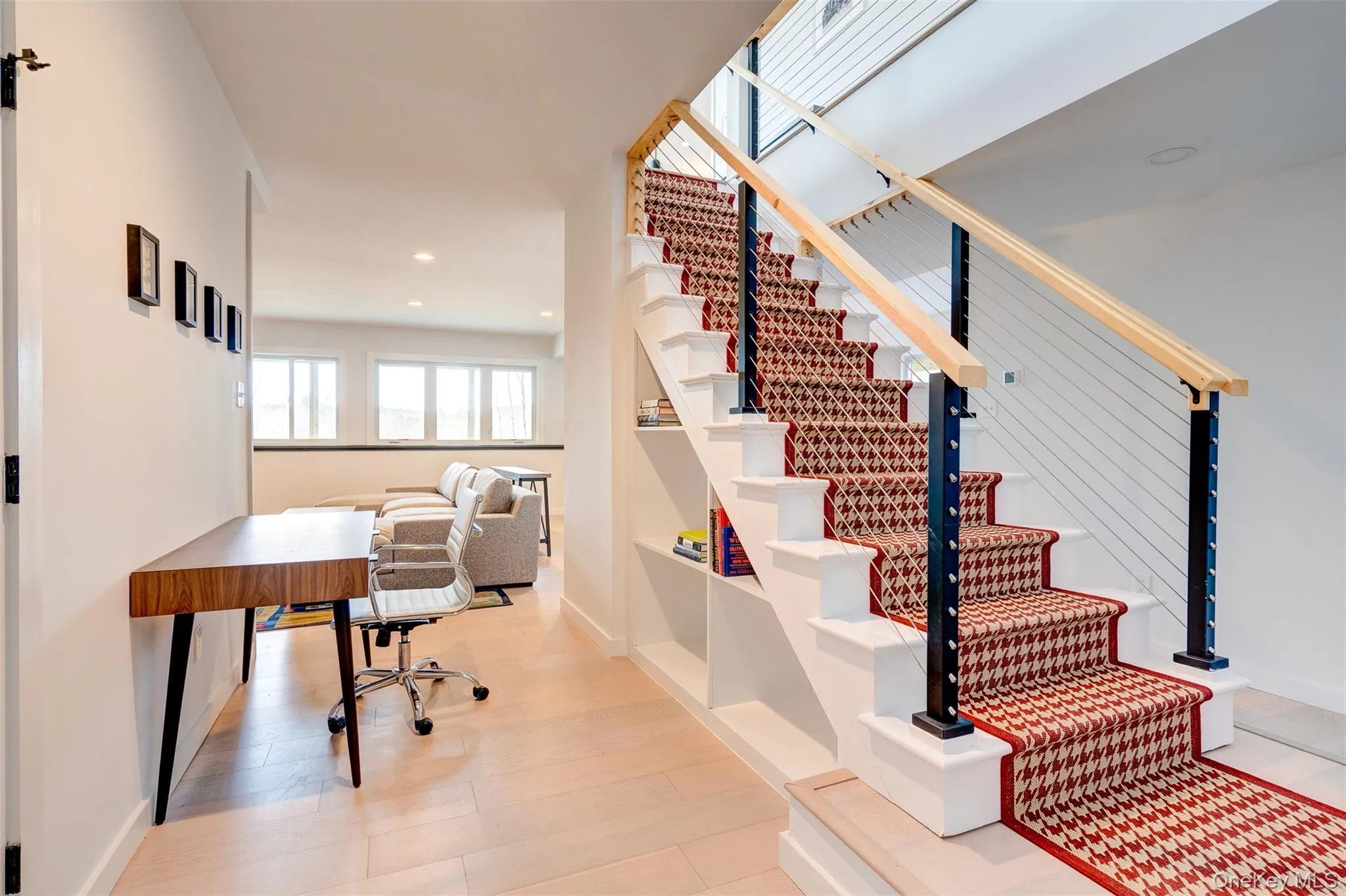 Stairs featuring recessed lighting and wood finished floors Stairs featuring recessed lighting and wood finished floors