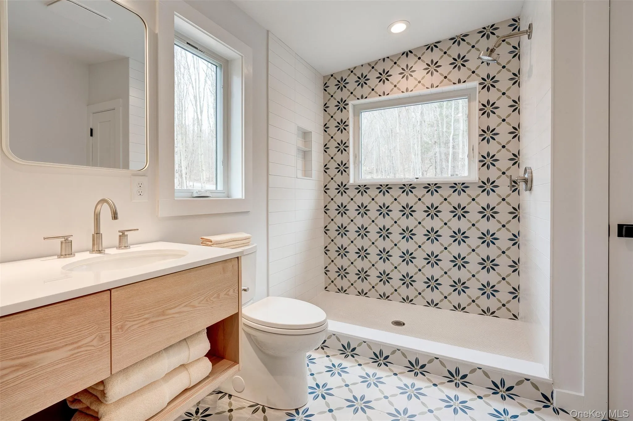 Full bath with vanity and a stall shower Full bath with vanity and a stall shower