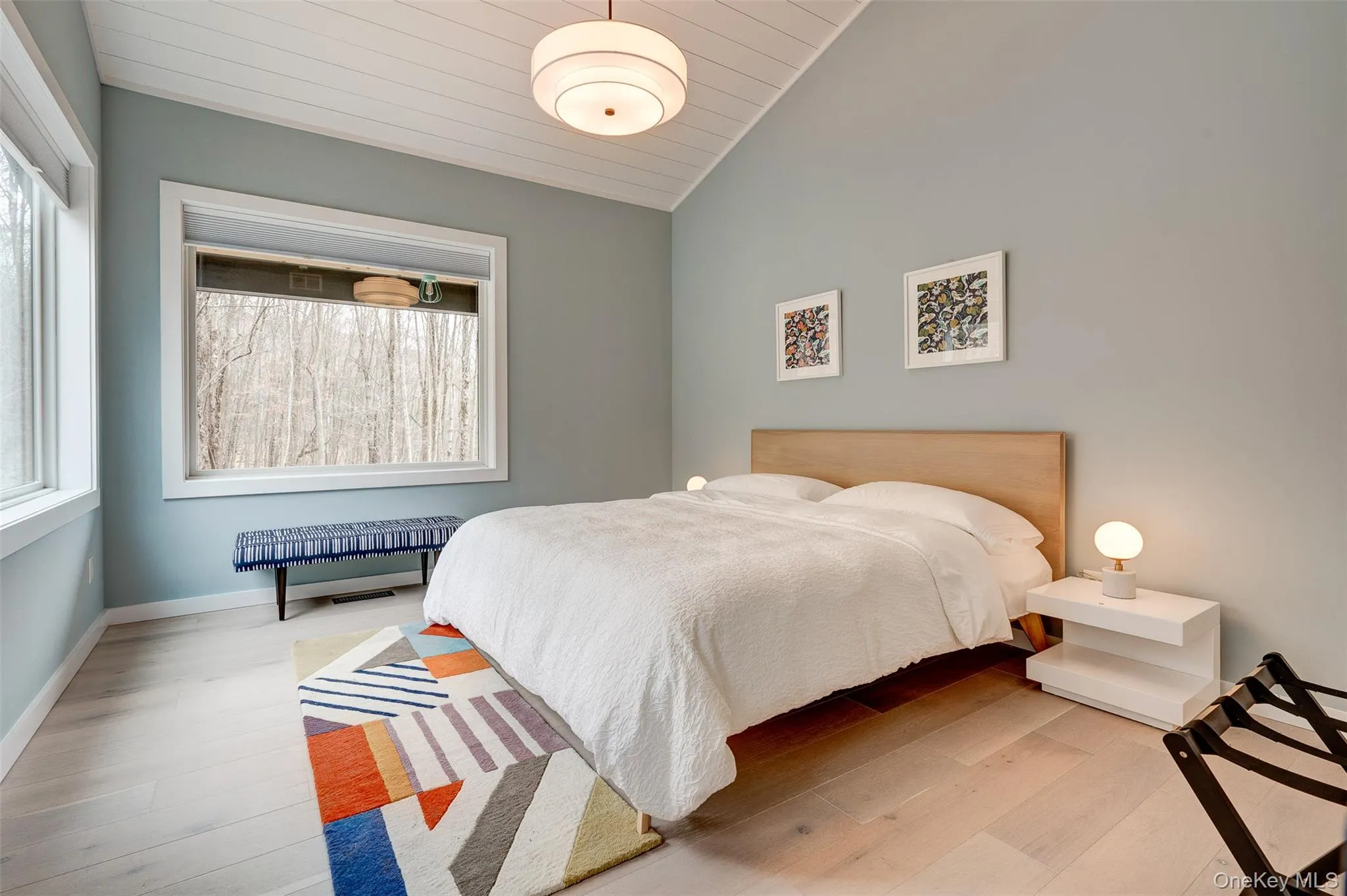 Bedroom featuring vaulted ceiling, wood finished floors, radiator, and wooden ceiling Bedroom featuring vaulted ceiling, wood finished floors, radiator, and wooden ceiling