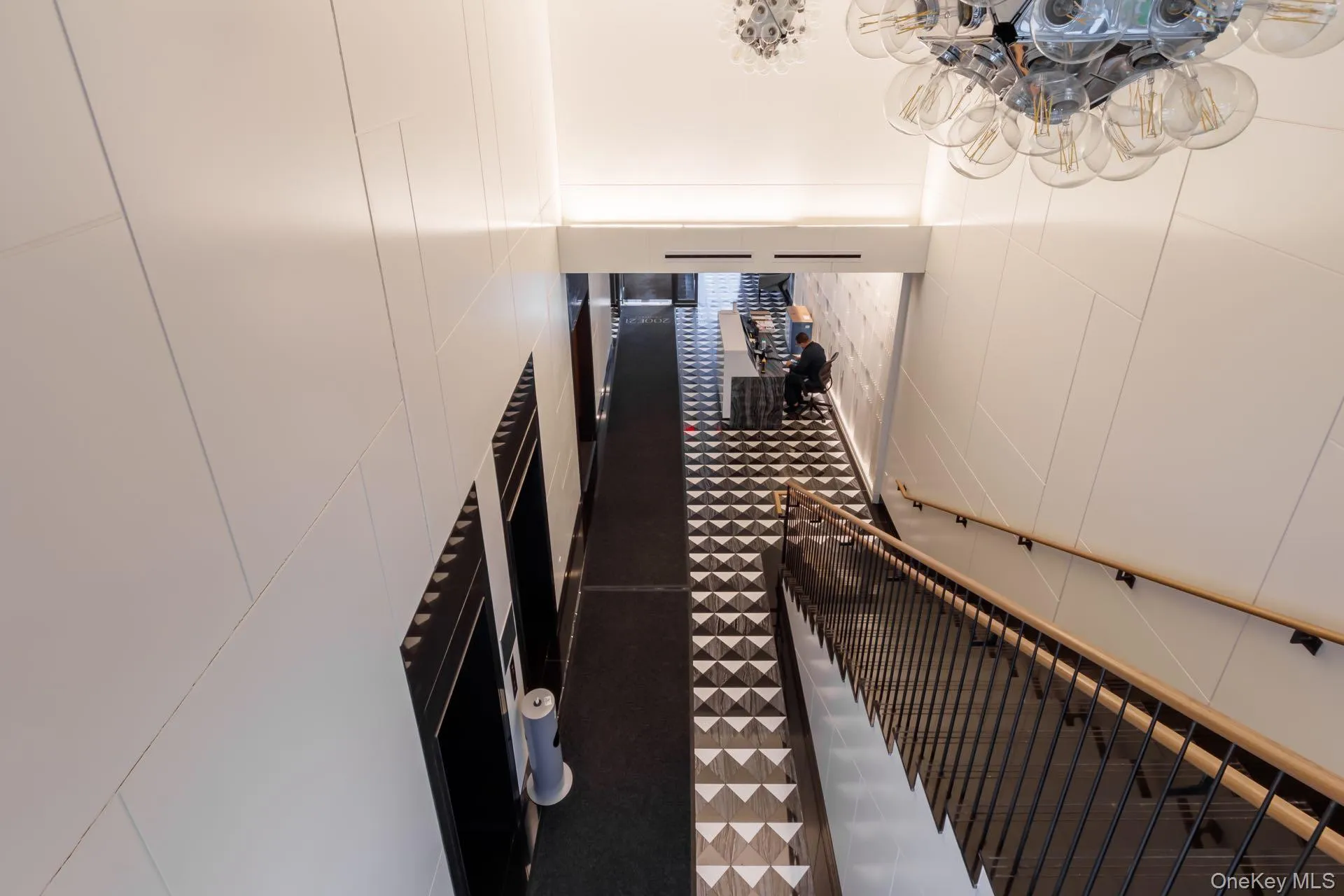 Stairway with tile patterned floors and a decorative wall Stairway with tile patterned floors and a decorative wall