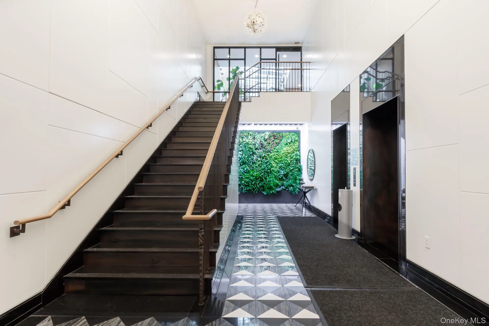 Stairway with a high ceiling and a chandelier Stairway with a high ceiling and a chandelier