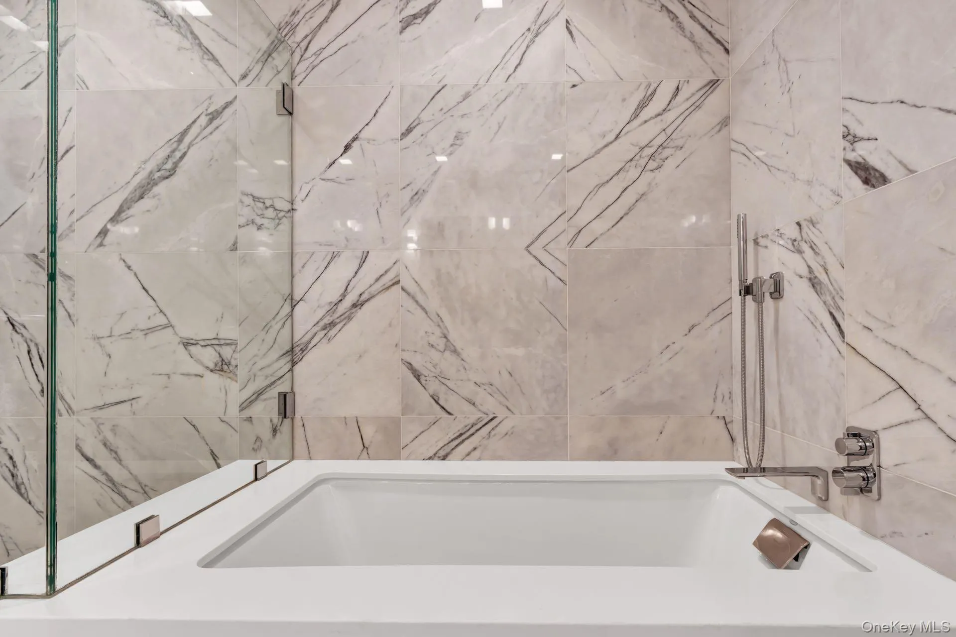 Bathroom featuring a tub Bathroom featuring a tub