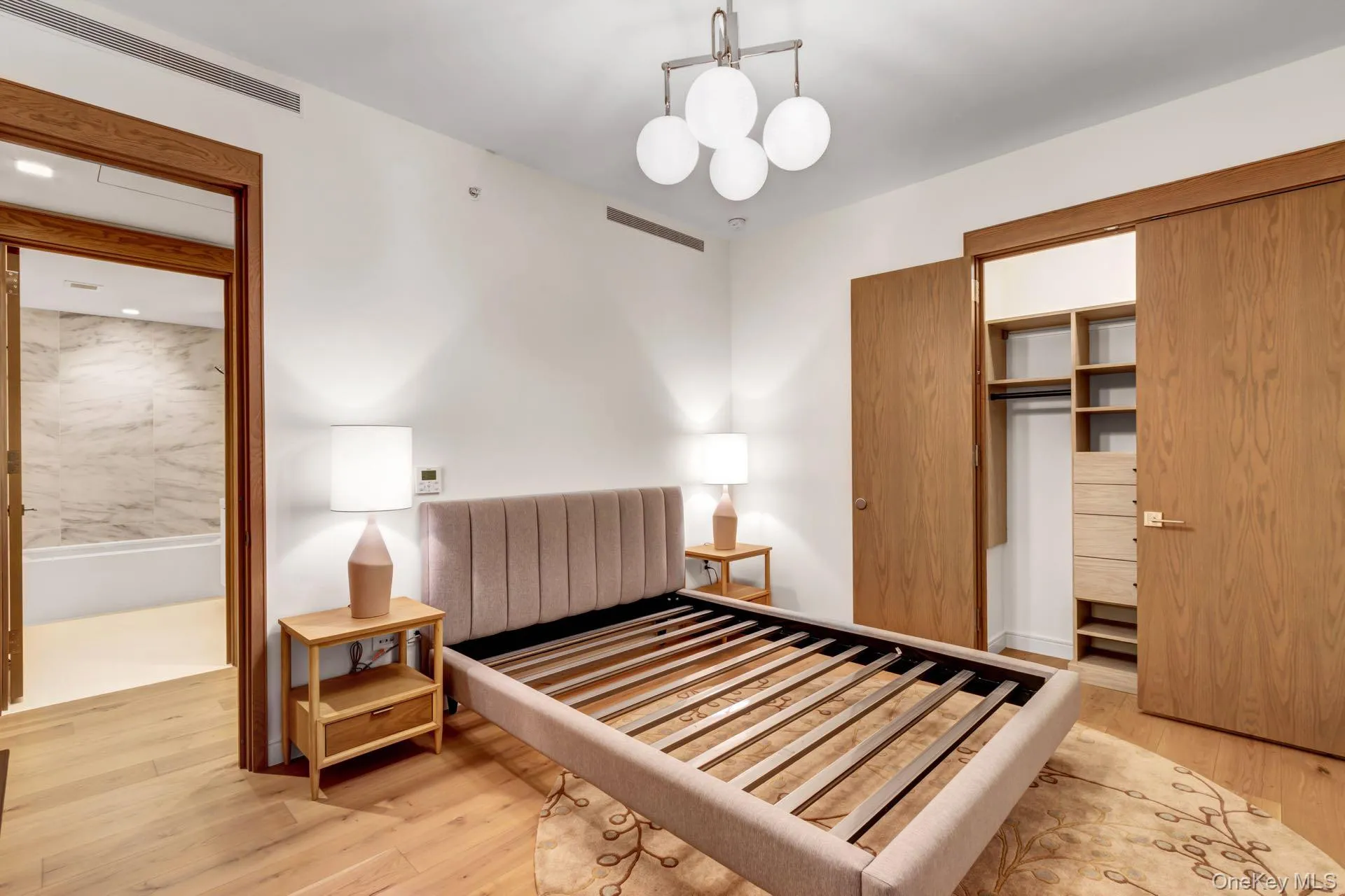Bedroom with light wood-style floors. Bedroom with light wood-style floors.