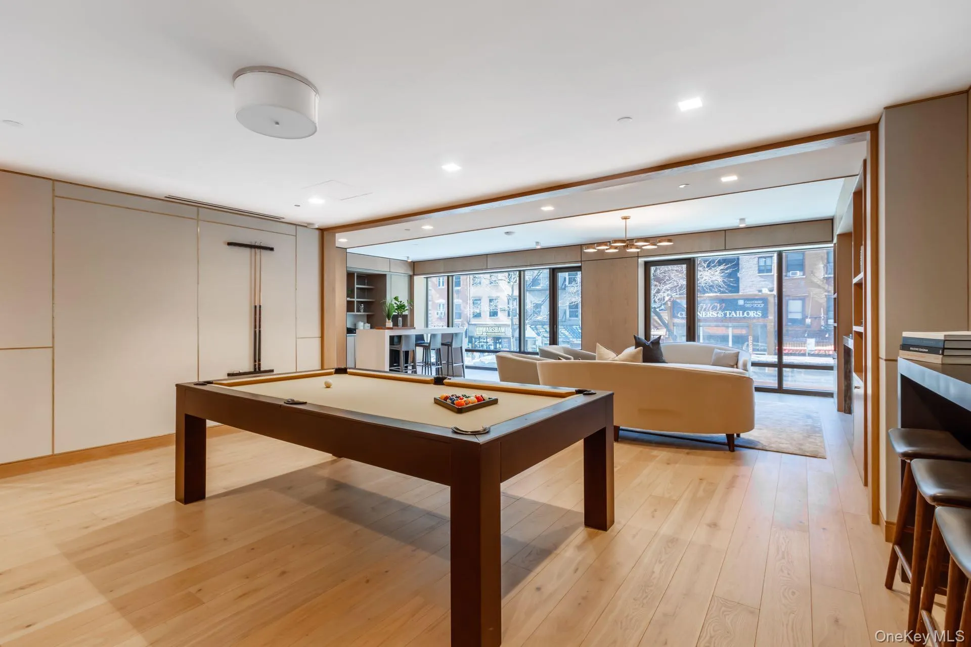 Lounge with billiards, light wood-style floors, recessed lighting, and a chandelier Lounge with billiards, light wood-style floors, recessed lighting, and a chandelier