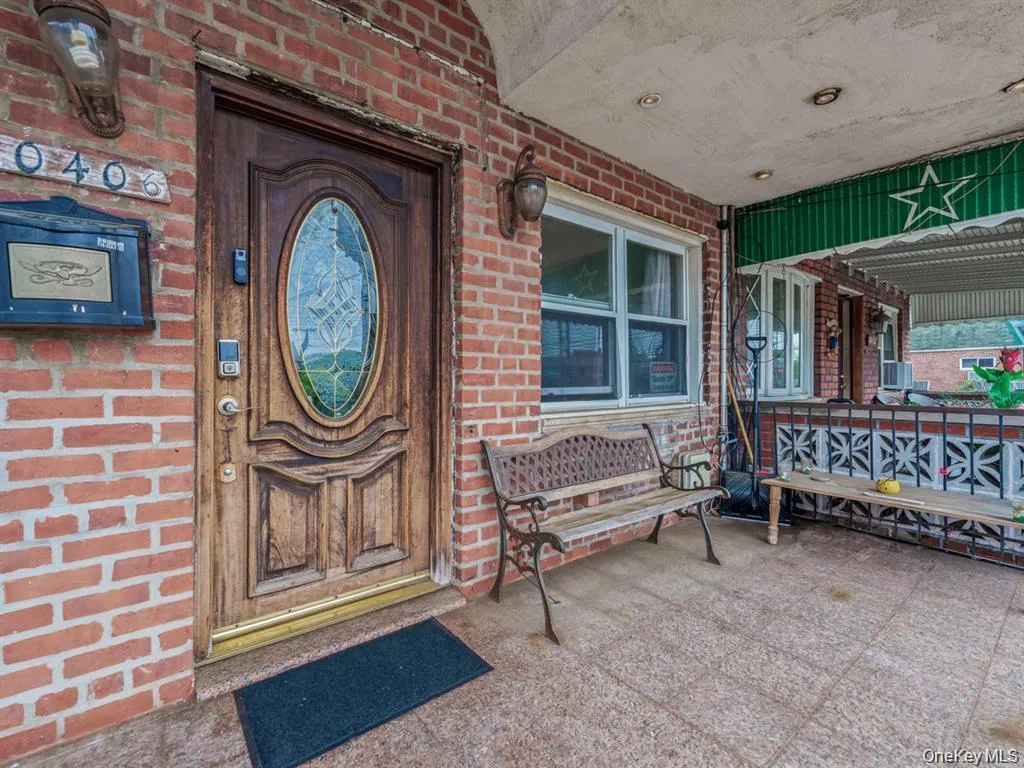 View of exterior entry with brick siding View of exterior entry with brick siding