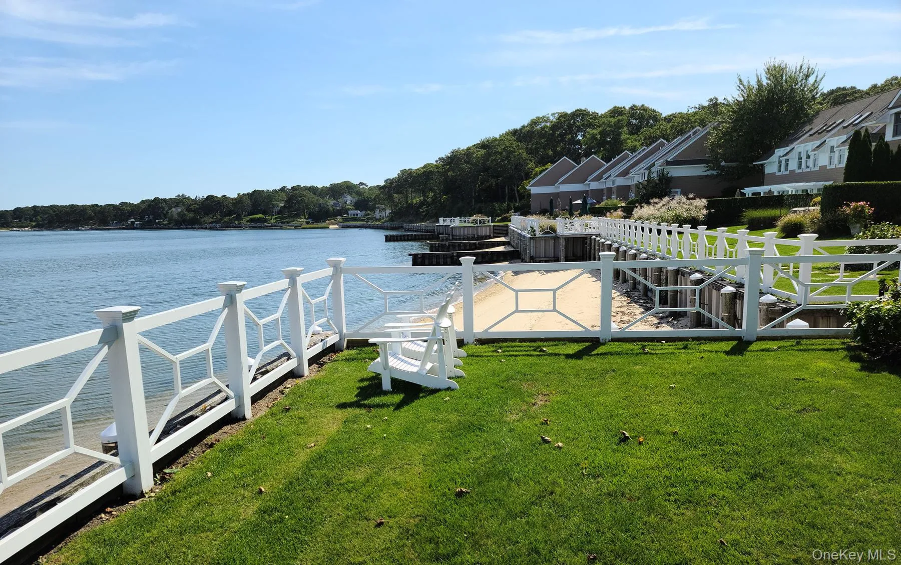 Dock with a lawn and a water view Dock with a lawn and a water view