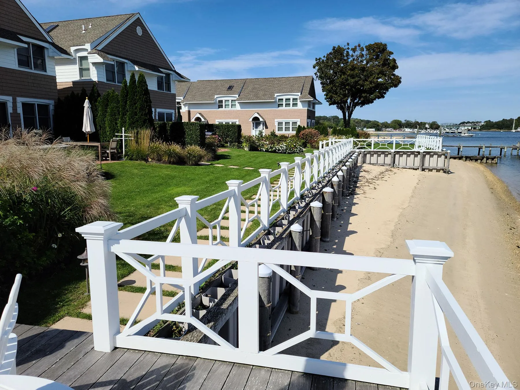 Dock featuring a water view and a yard Dock featuring a water view and a yard