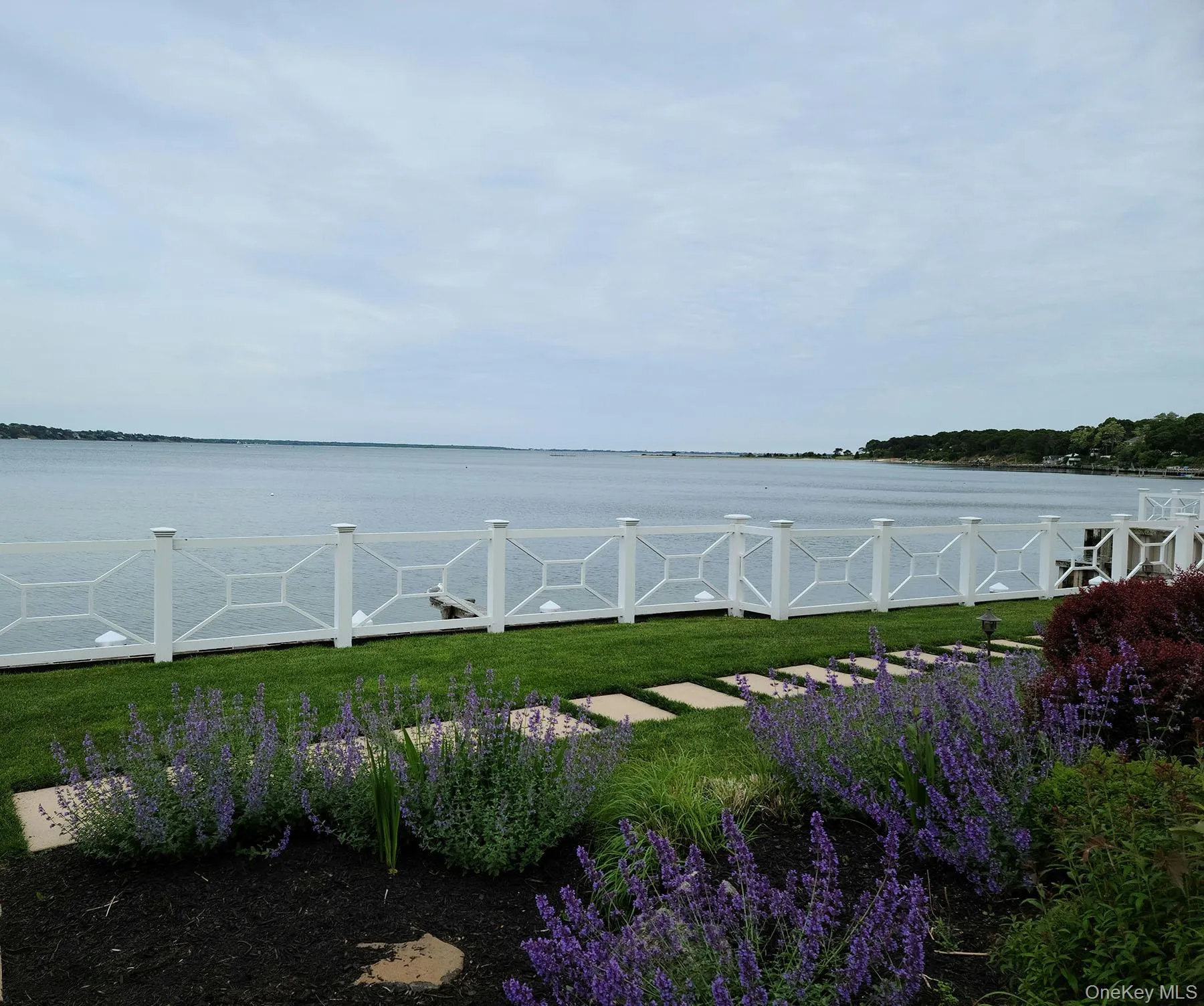 View of grassy yard with a water view View of grassy yard with a water view