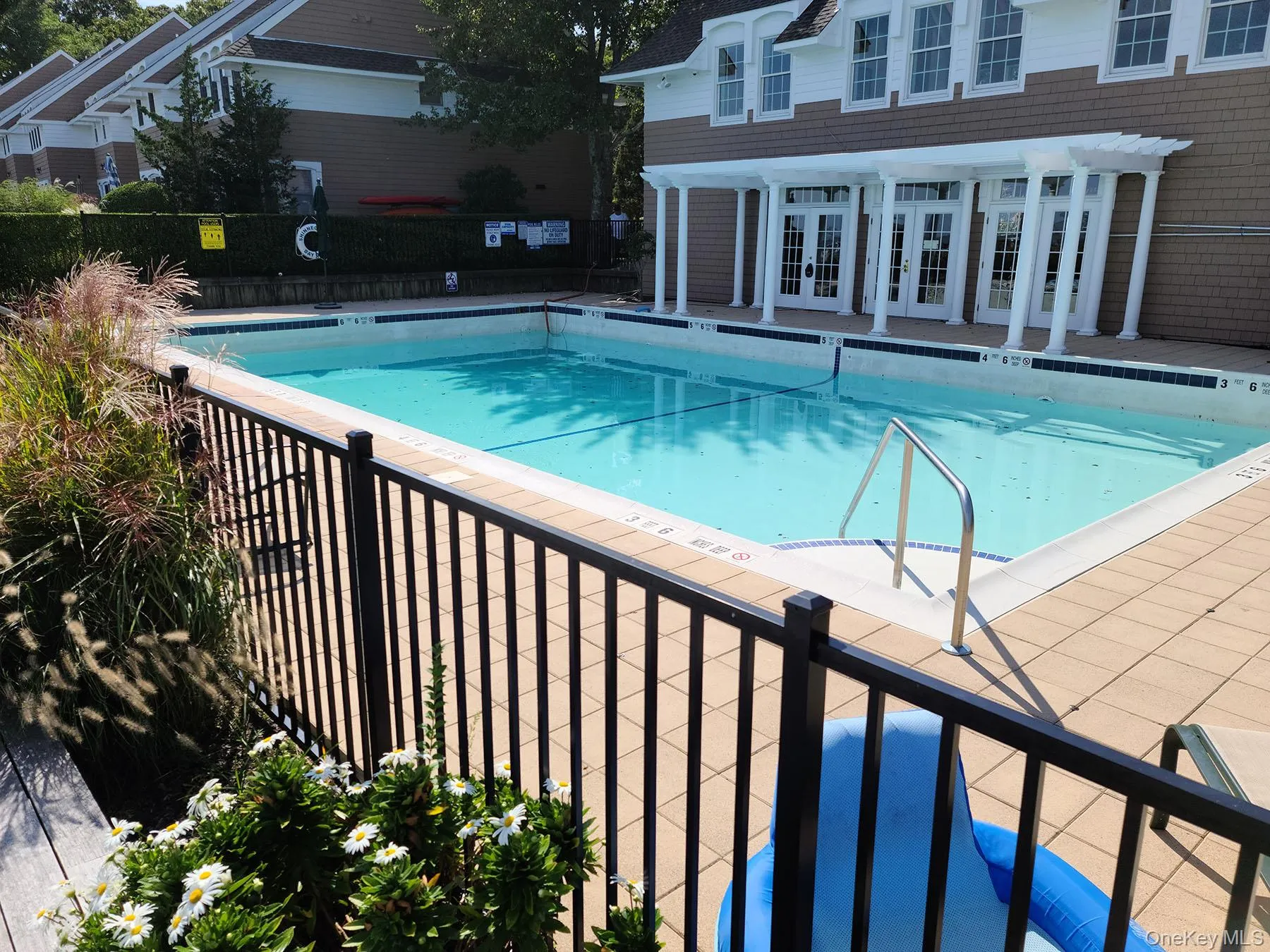 Community pool featuring a patio area, french doors, and a pergola Community pool featuring a patio area, french doors, and a pergola