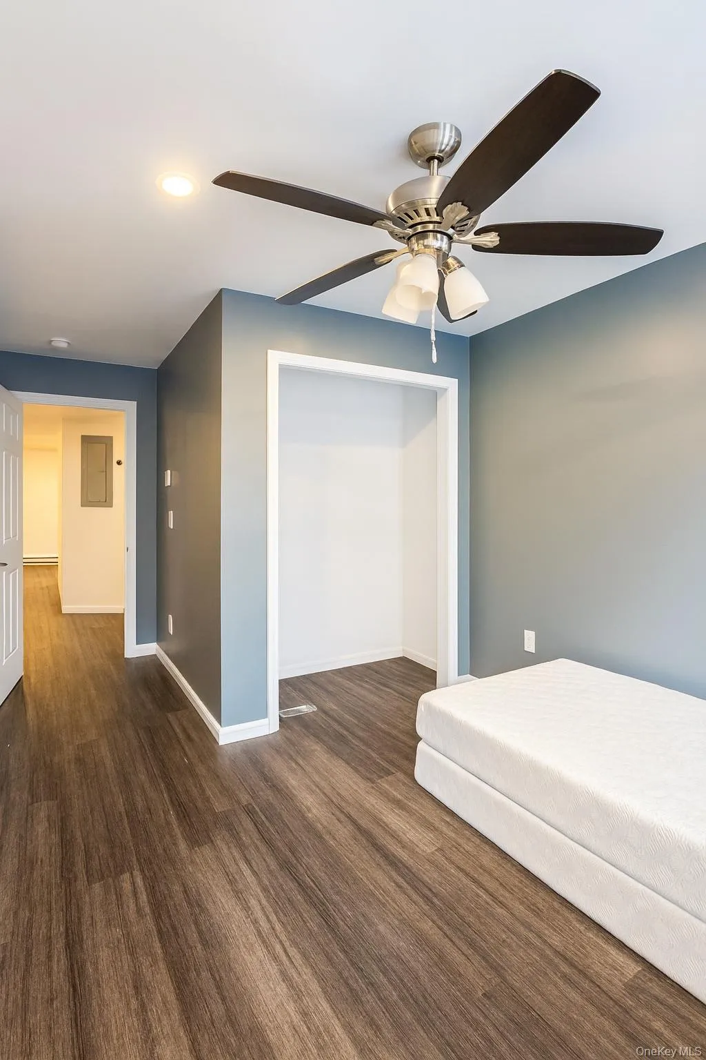 Bedroom featuring ceiling fan, recessed lighting, and dark wood-type flooring Bedroom featuring ceiling fan, recessed lighting, and dark wood-type flooring