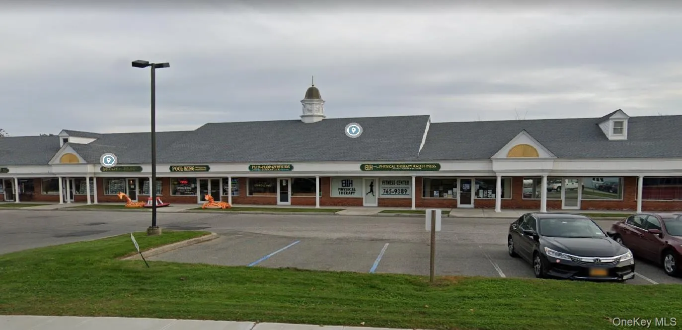 View of commercial property featuring uncovered parking View of commercial property featuring uncovered parking