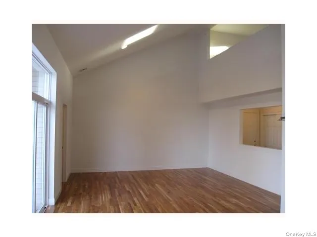 Living room has lots of natural sunlight, skylights, cathedral ceilings and sliders to deck.... Living room has lots of natural sunlight, skylights, cathedral ceilings and sliders to deck....