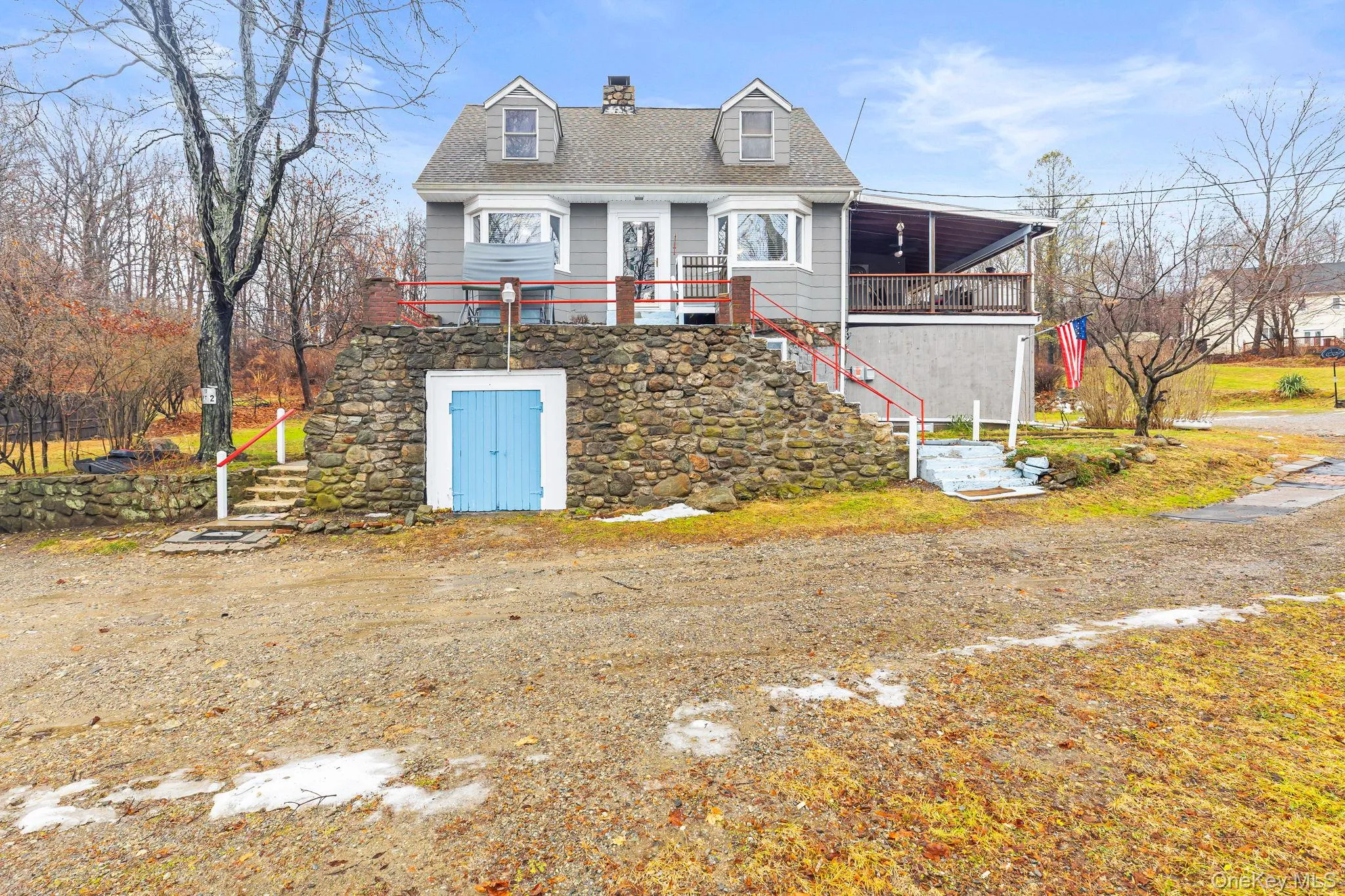 View of front of house with stairway, a chimney, and roof with shingles View of front of house with stairway, a chimney, and roof with shingles