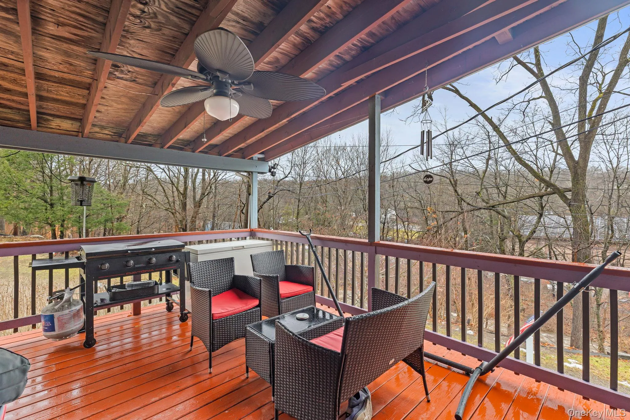 Wooden terrace featuring a ceiling fan Wooden terrace featuring a ceiling fan