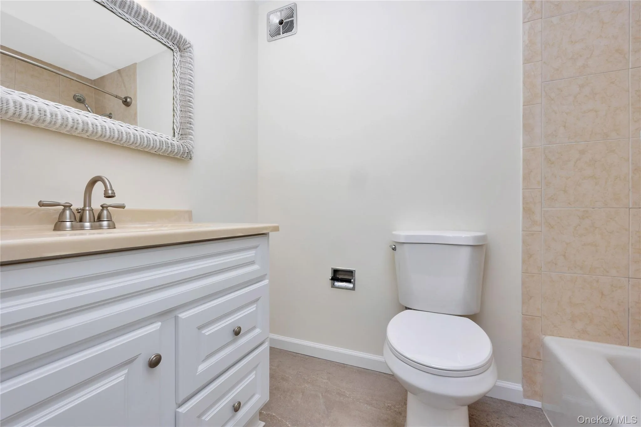 Full bathroom with vanity and tub / shower combination Full bathroom with vanity and tub / shower combination