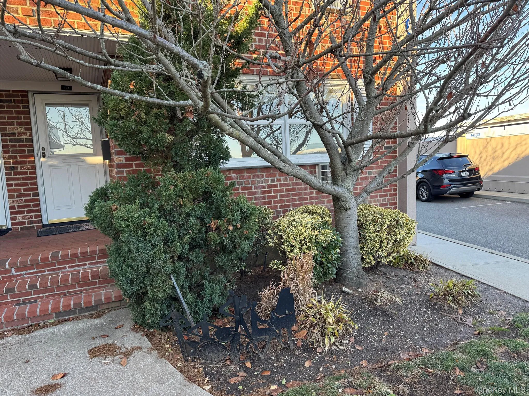Doorway to property featuring brick siding, end unit Doorway to property featuring brick siding, end unit