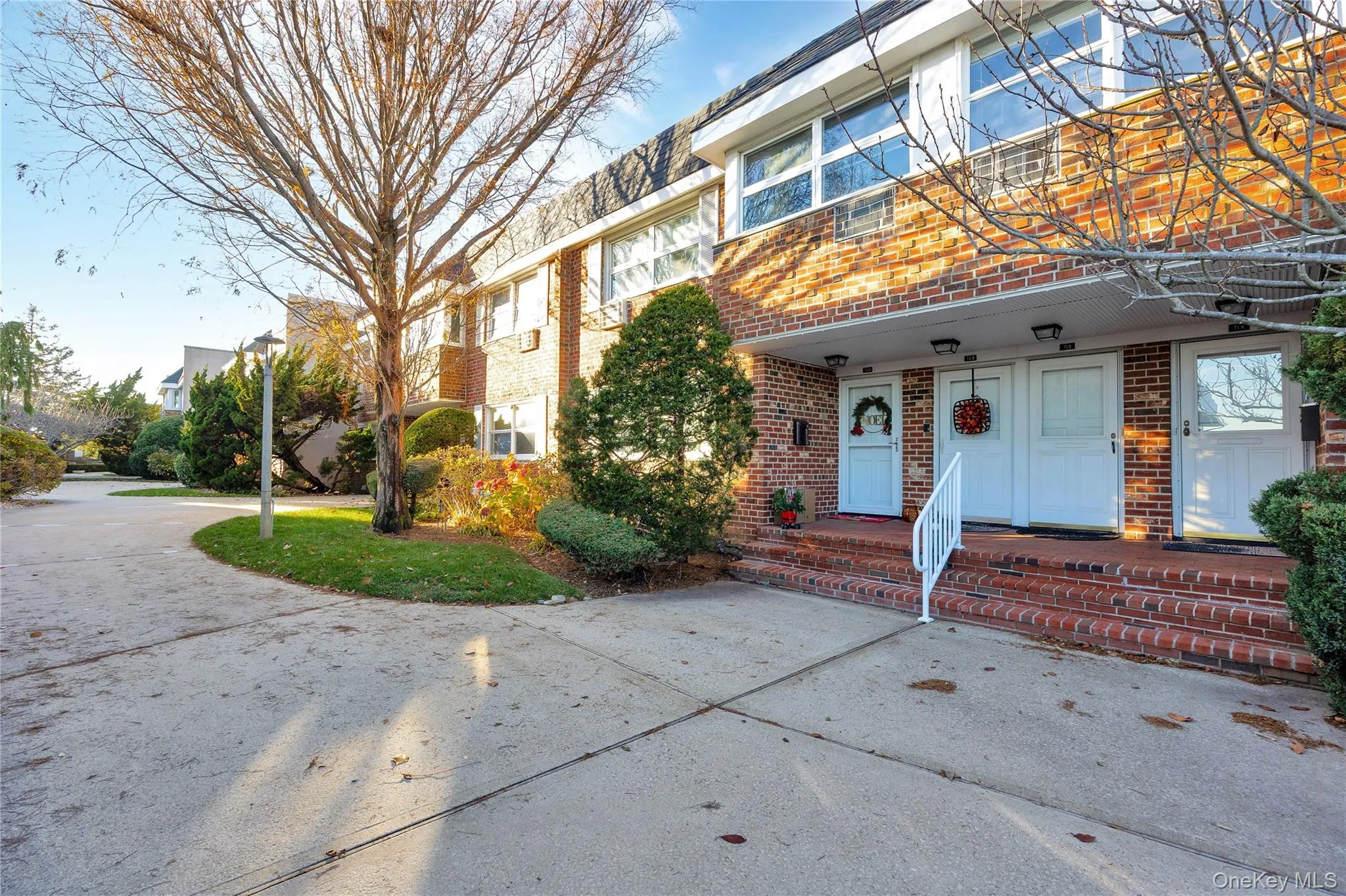 Doorway to property featuring brick siding Doorway to property featuring brick siding