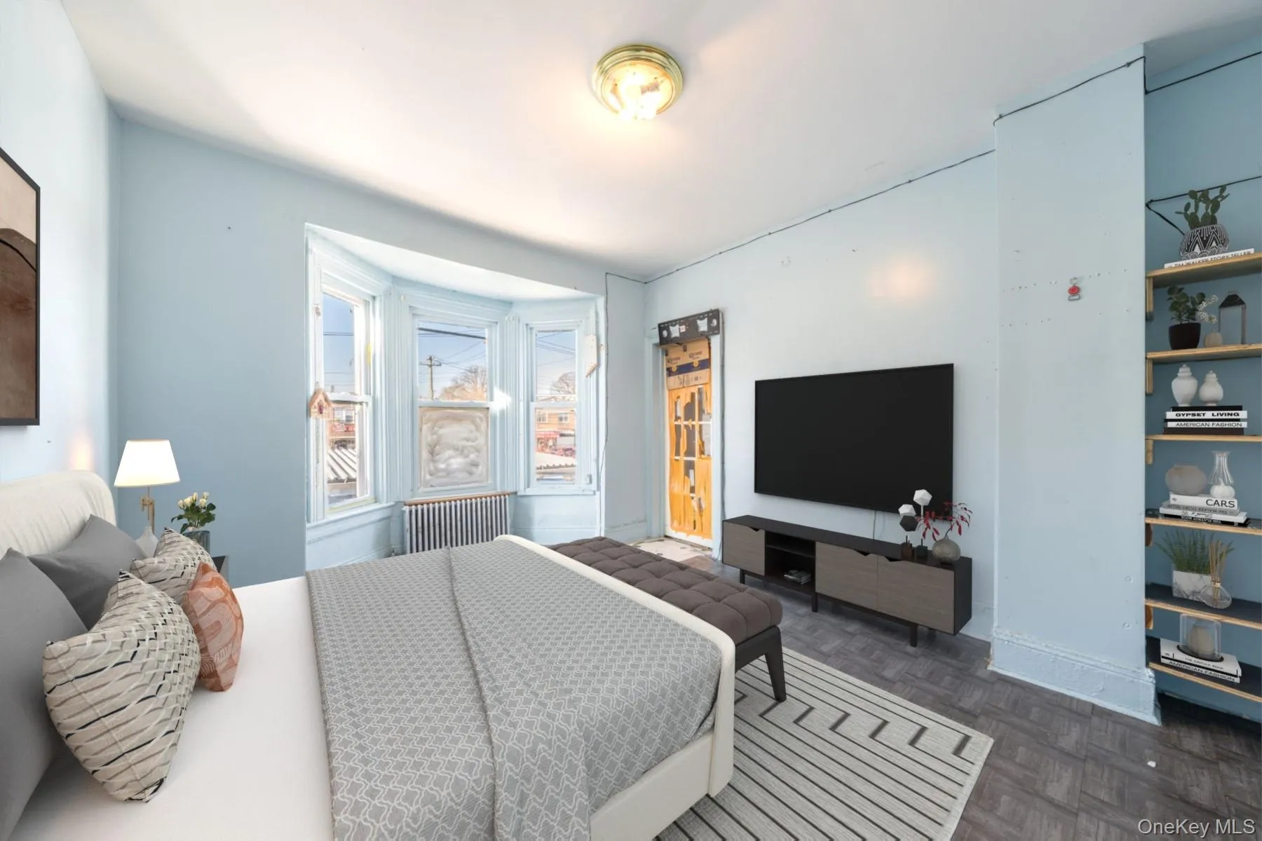 Bedroom featuring radiator heating unit and baseboards Bedroom featuring radiator heating unit and baseboards