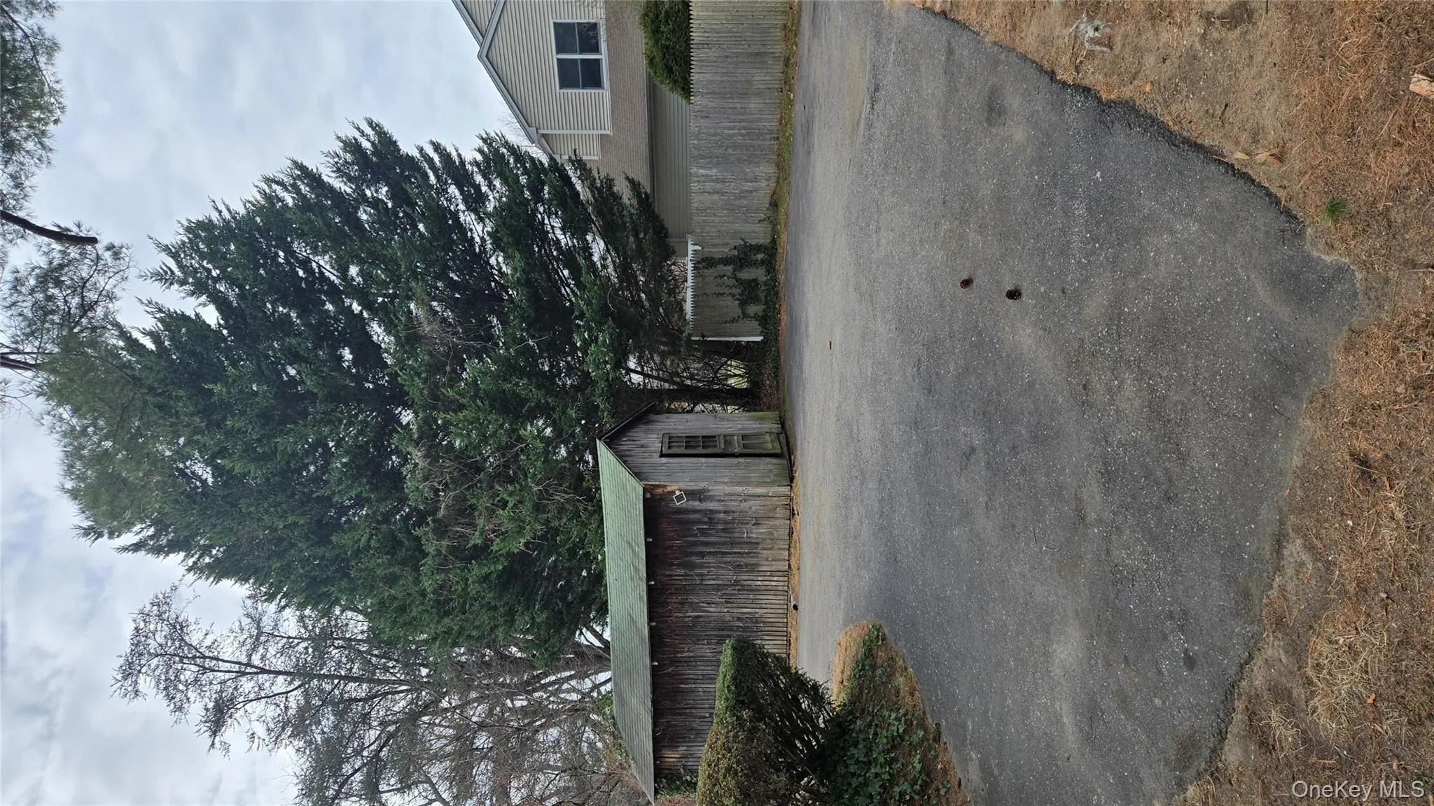 View of side of property featuring an outbuilding View of side of property featuring an outbuilding