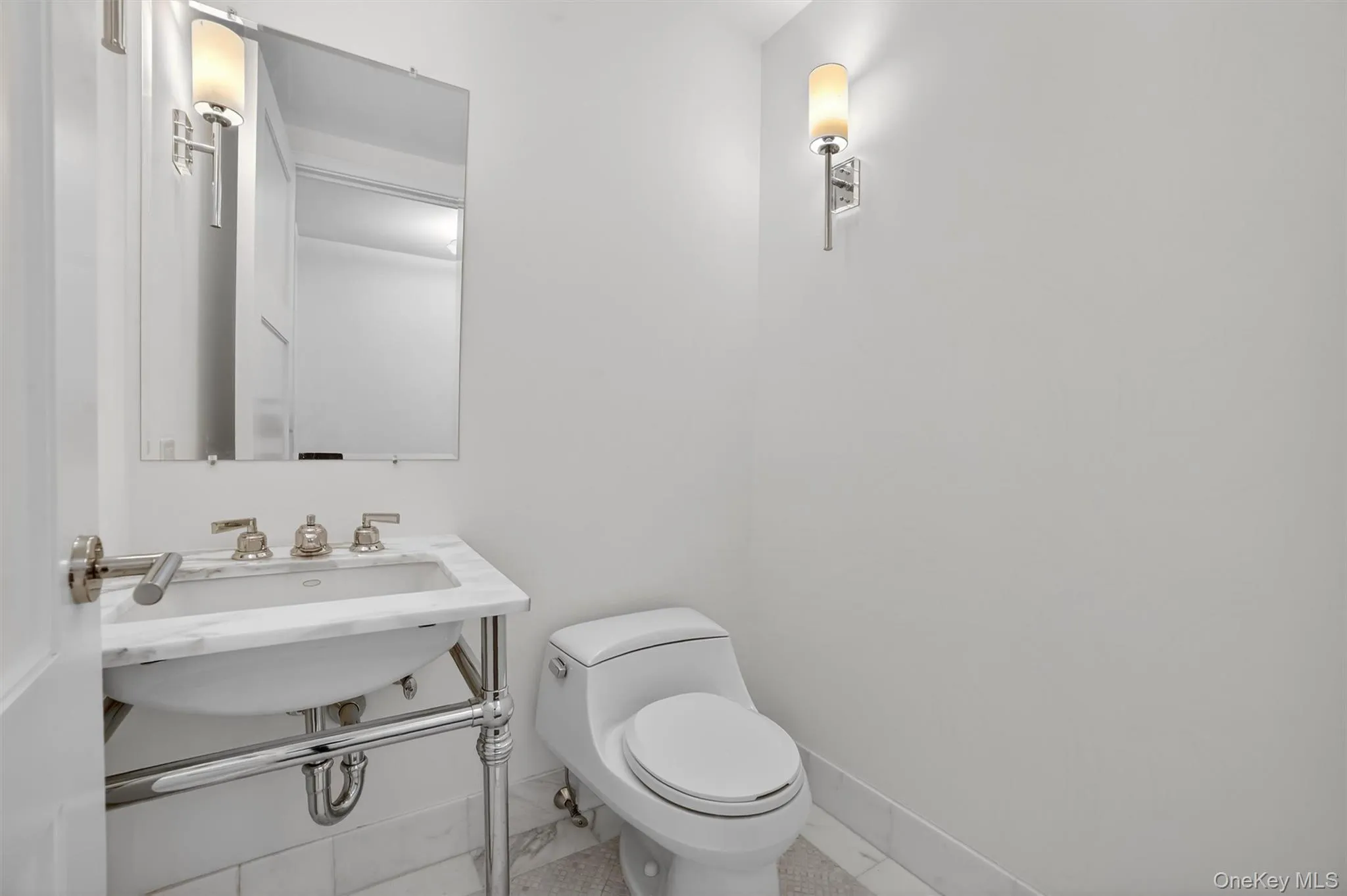 Half bathroom with baseboards and toilet Half bathroom with baseboards and toilet