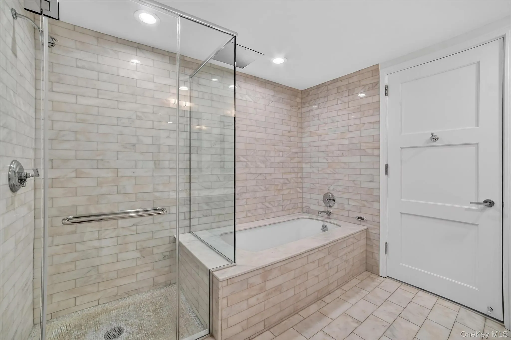 Bathroom with a garden tub, a shower stall, recessed lighting, and tile patterned flooring Bathroom with a garden tub, a shower stall, recessed lighting, and tile patterned flooring