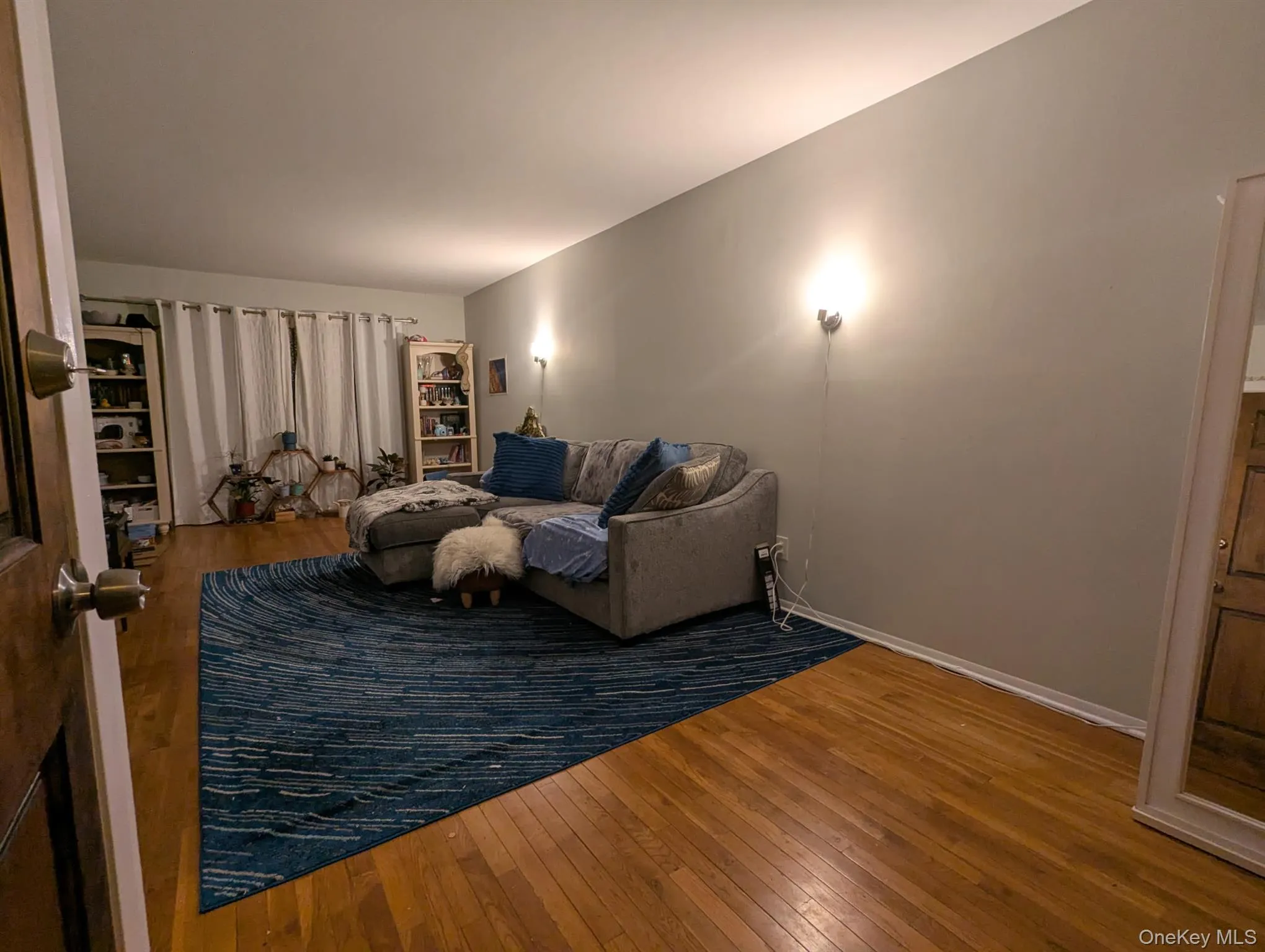 Living area featuring hardwood / wood-style flooring Living area featuring hardwood / wood-style flooring