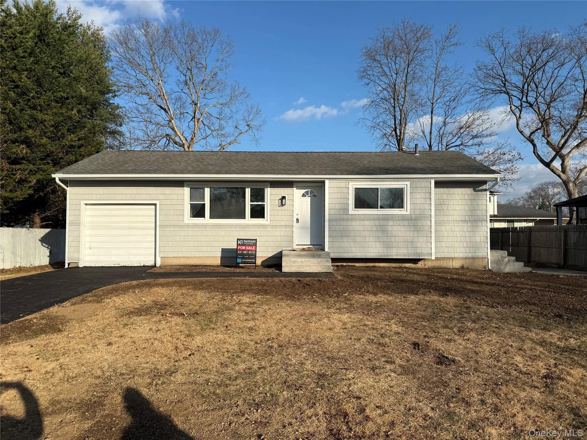 Single story home with roof with shingles, driveway, and a garage Single story home with roof with shingles, driveway, and a garage