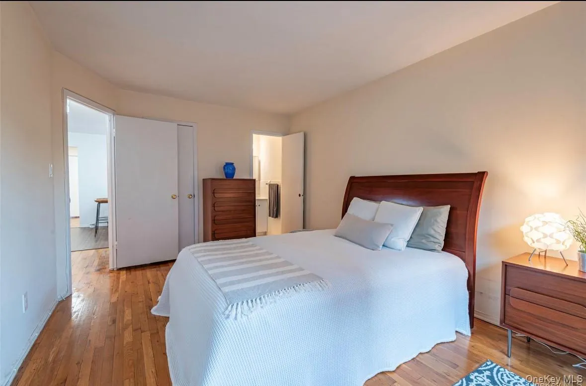 Bedroom with a closet and light wood-style floors Bedroom with a closet and light wood-style floors