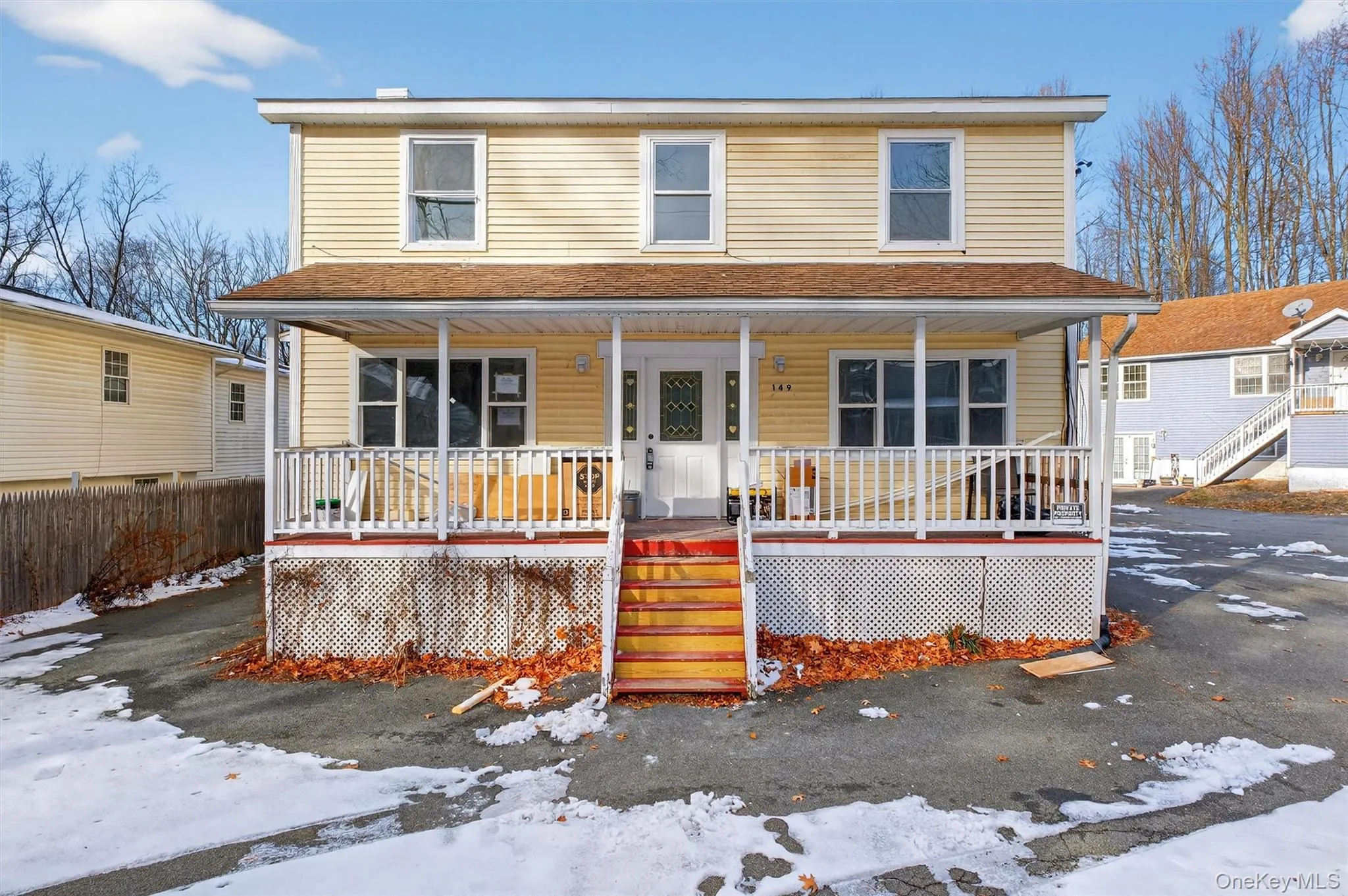 View of front of house with covered porch, stairs, and a shingled roof View of front of house with covered porch, stairs, and a shingled roof