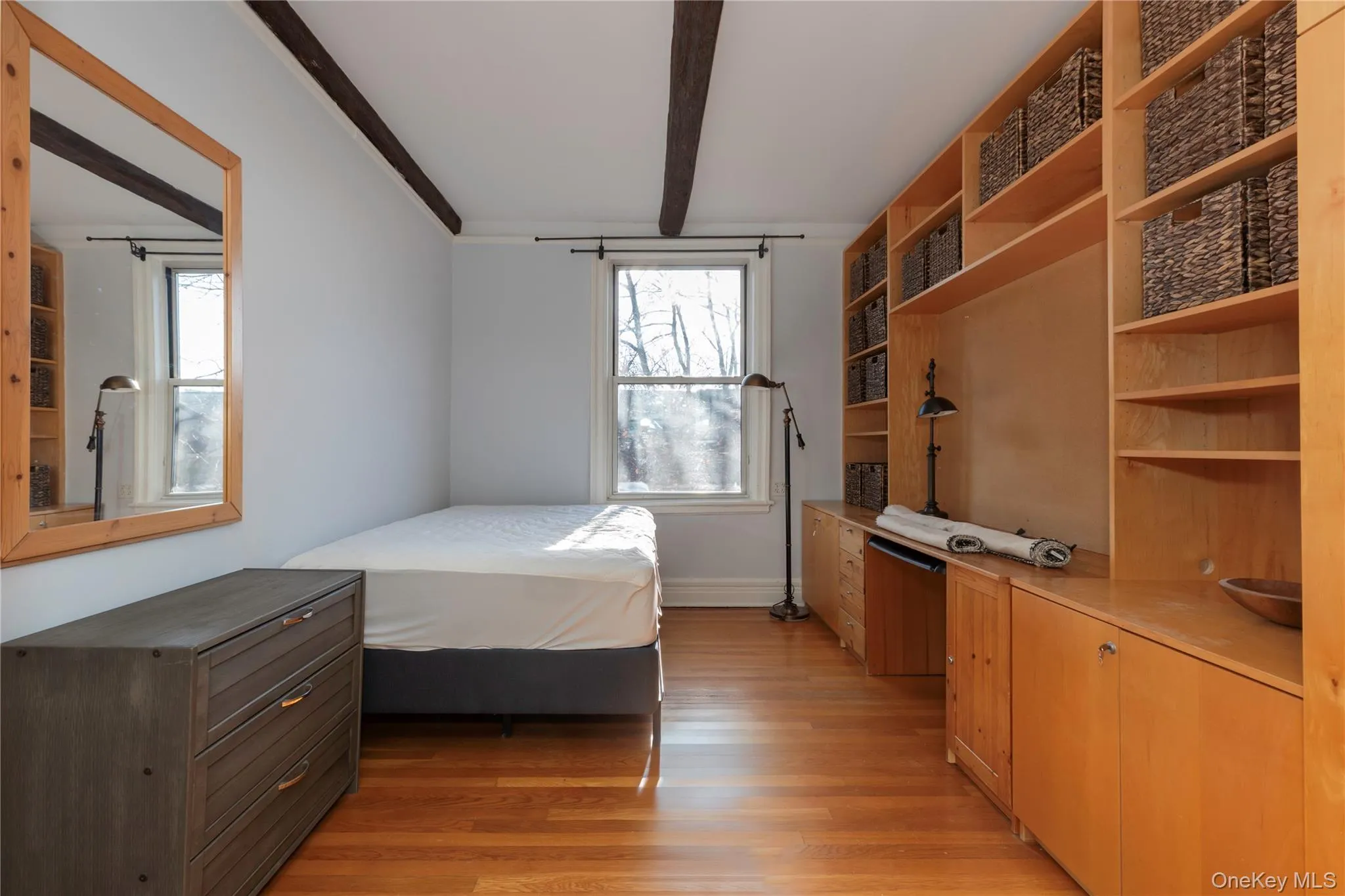 Bedroom/den/office/living room with a fireplace, beamed ceiling Bedroom/den/office/living room with a fireplace, beamed ceiling