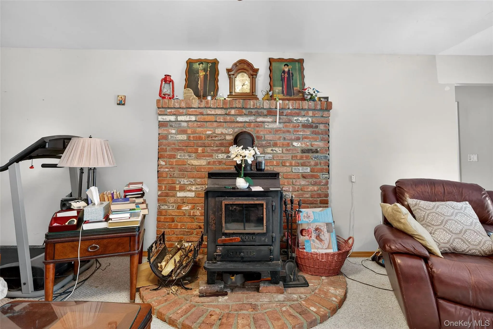 Living room featuring a wood stove Living room featuring a wood stove