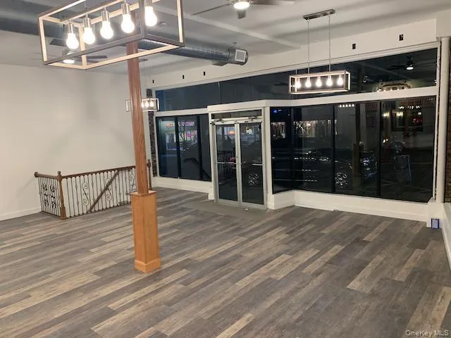 Room with dark wood-style flooring Room with dark wood-style flooring