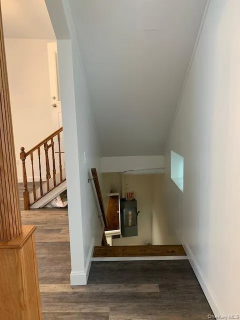 Stairs with ornamental molding and wood finished floors Stairs with ornamental molding and wood finished floors