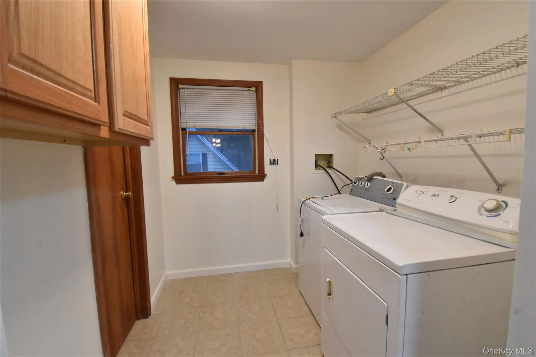 Laundry area featuring washer and clothes dryer and cabinet space Laundry area featuring washer and clothes dryer and cabinet space