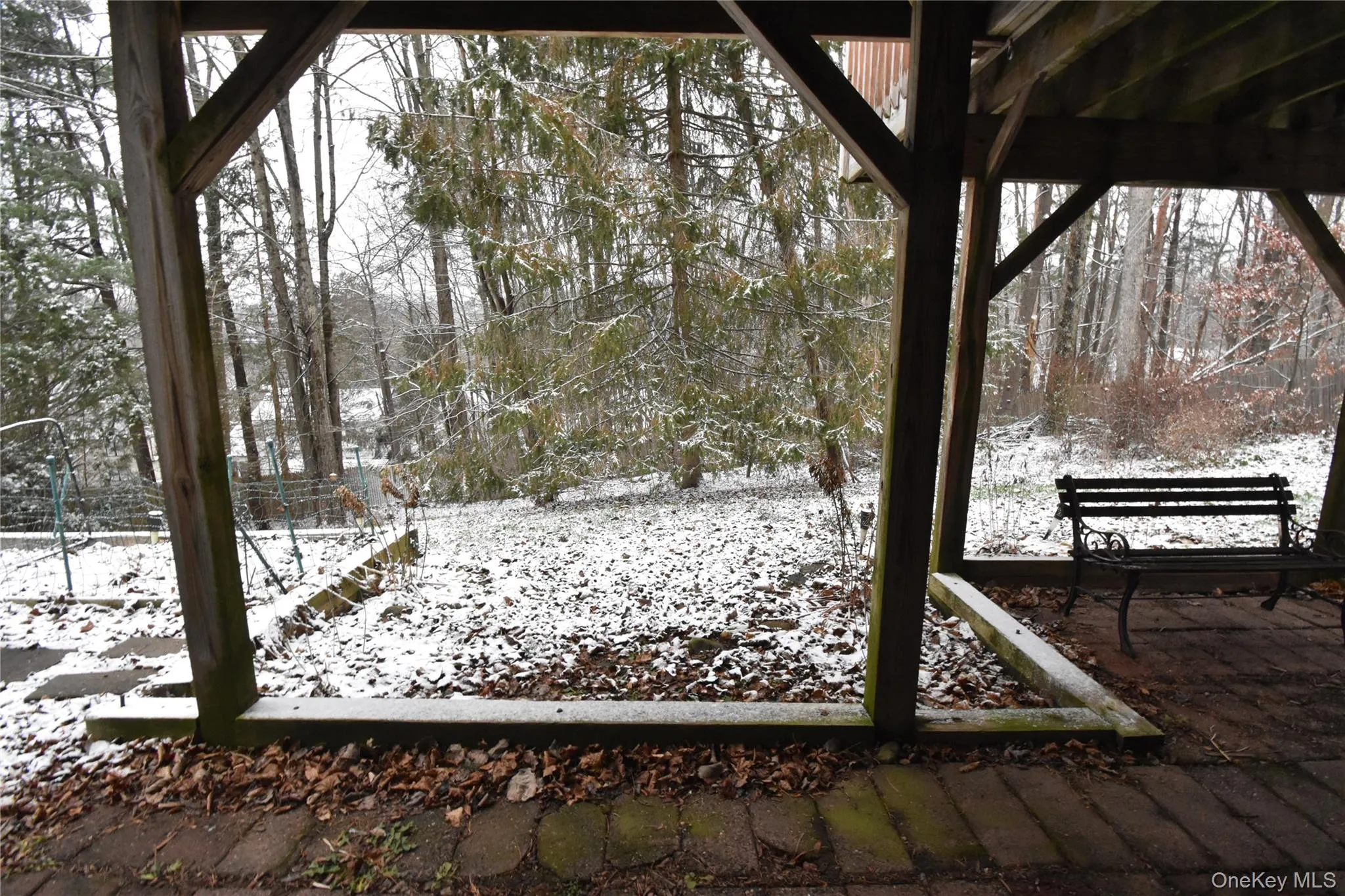 View of yard layered in snow View of yard layered in snow