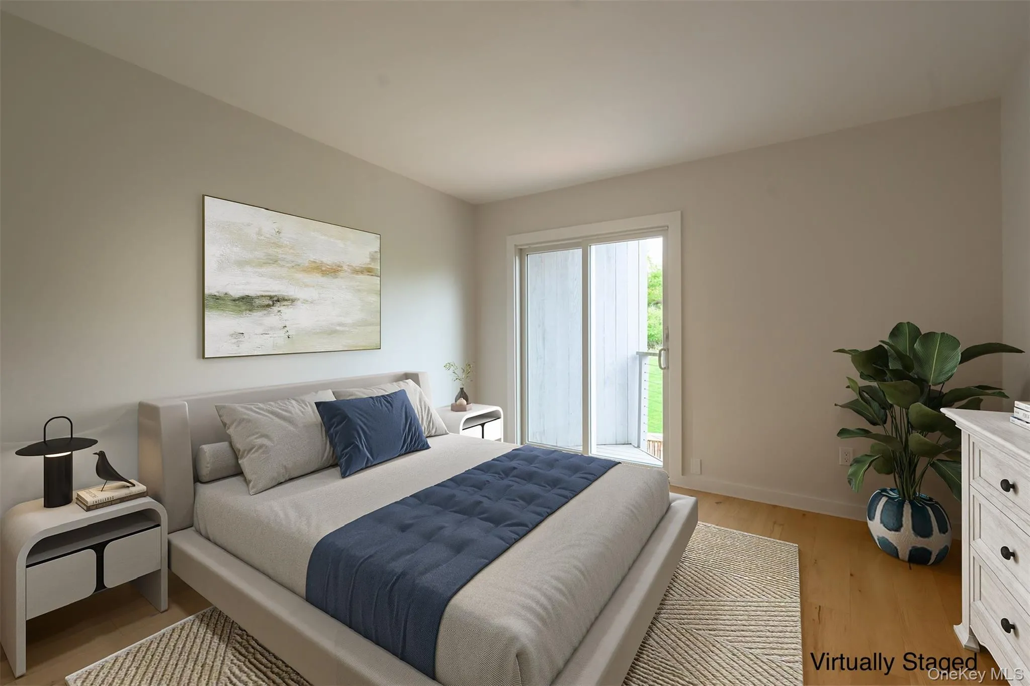 Bedroom featuring light wood-style flooring and baseboards Bedroom featuring light wood-style flooring and baseboards