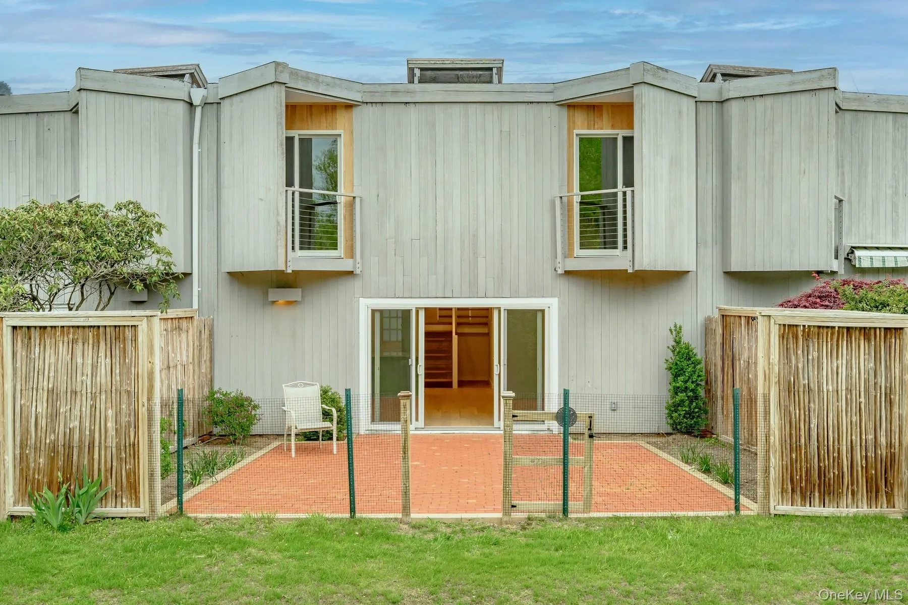Back of house with a fenced backyard Back of house with a fenced backyard