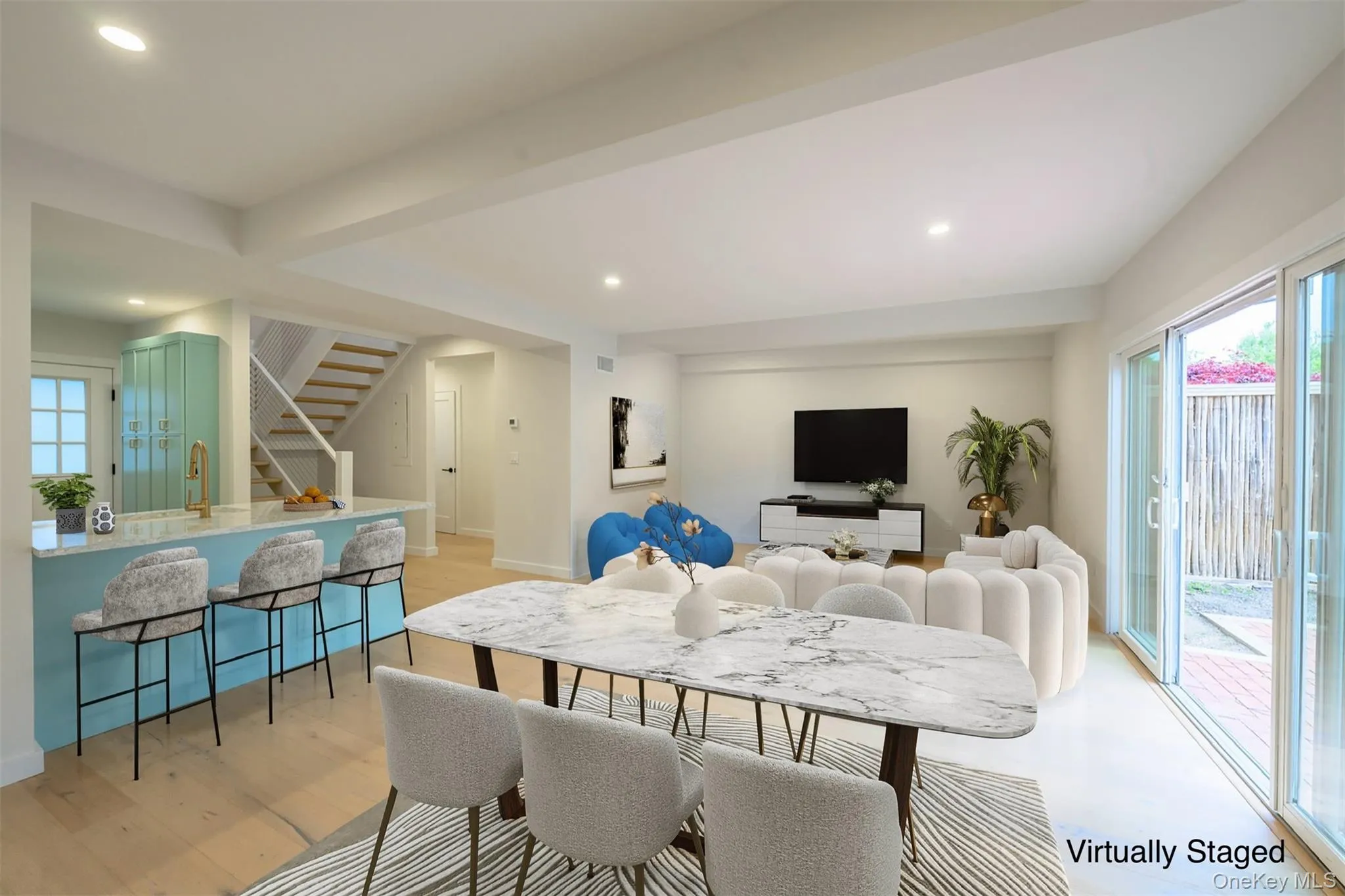 Dining space featuring recessed lighting, stairs, and light wood-style flooring Dining space featuring recessed lighting, stairs, and light wood-style flooring