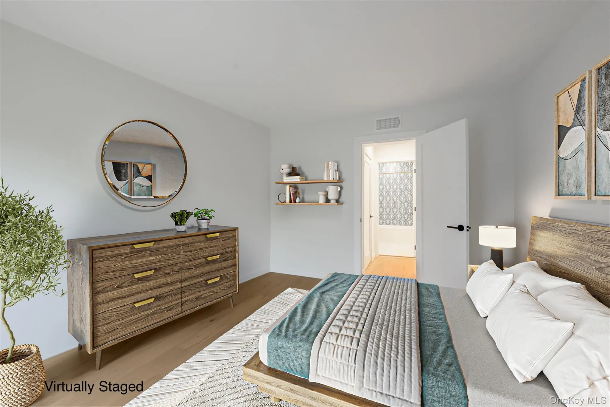 Bedroom featuring wood finished floors and ensuite bathroom Bedroom featuring wood finished floors and ensuite bathroom