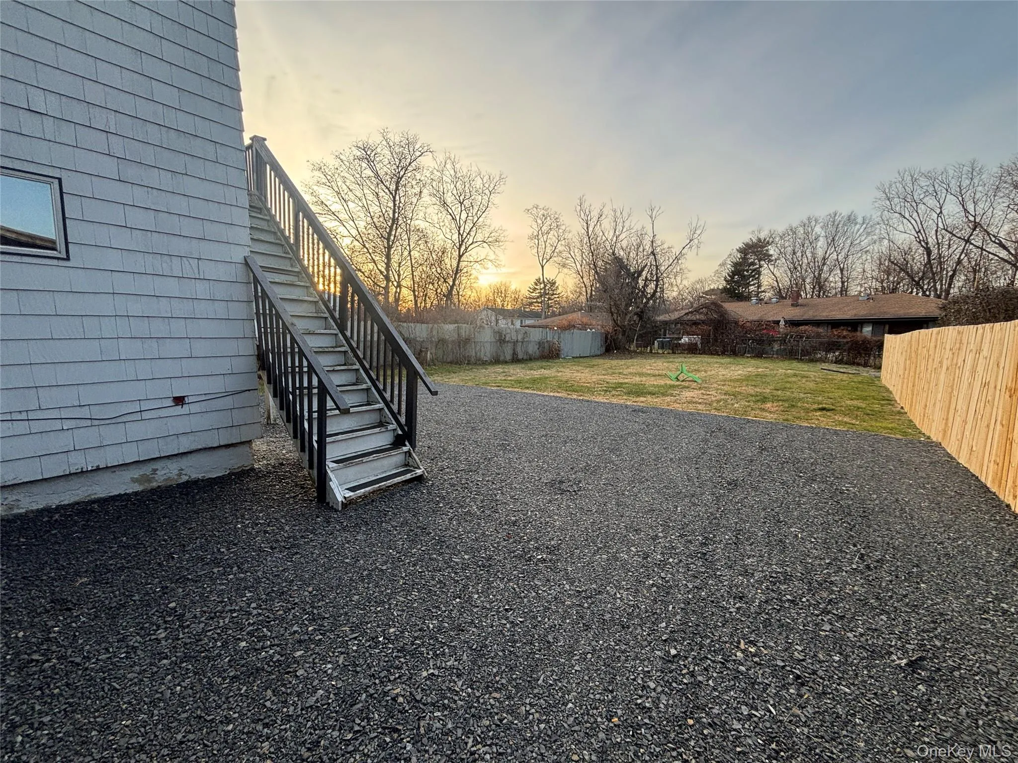 Fenced backyard with stairway Fenced backyard with stairway