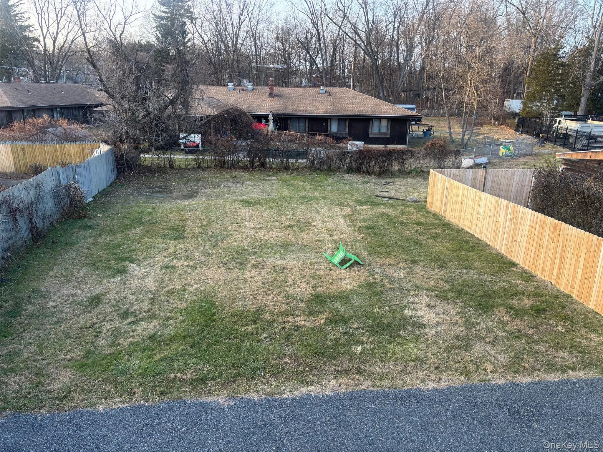 View of yard featuring view of wooded area View of yard featuring view of wooded area