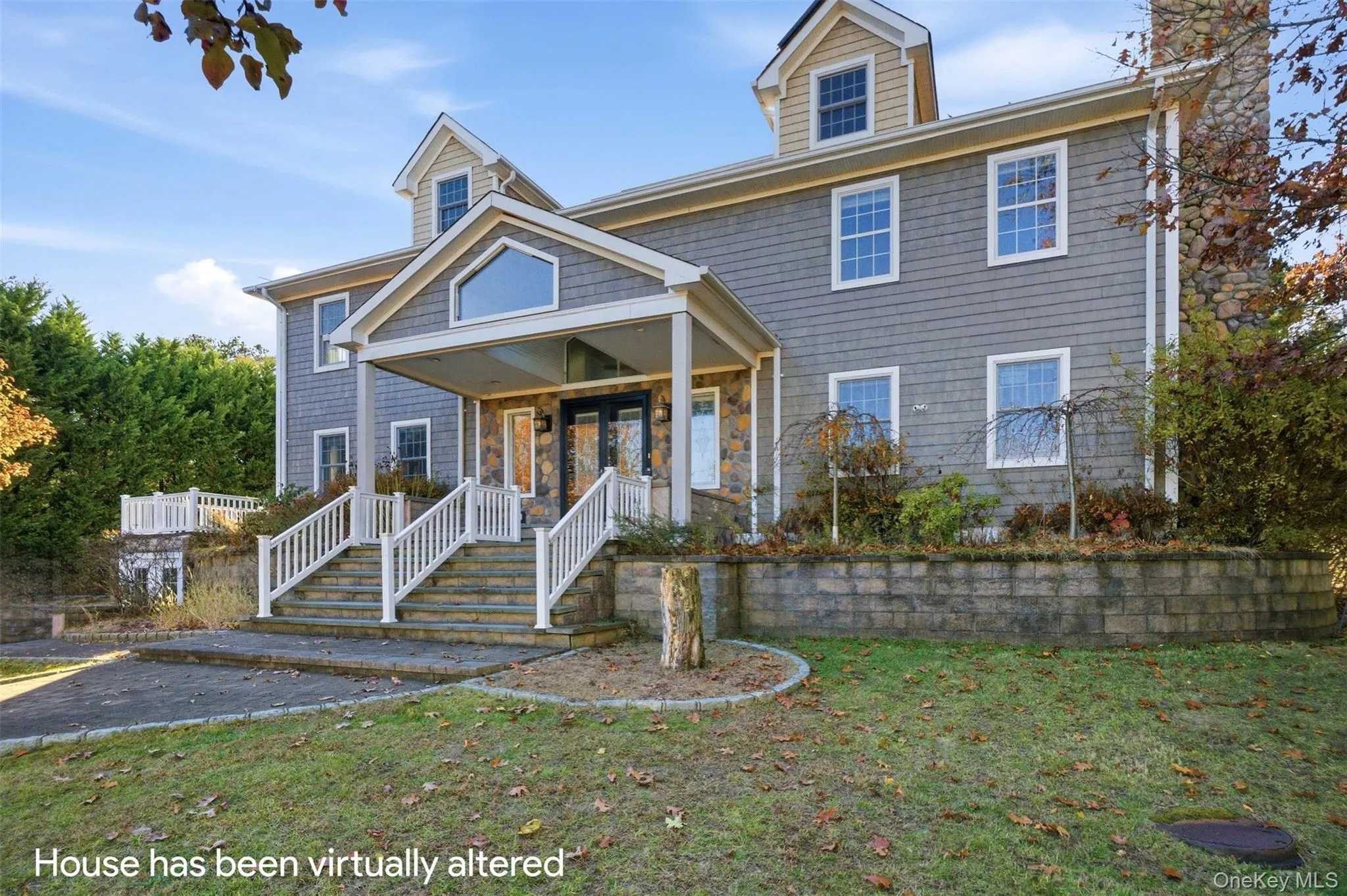 View of front of property featuring a front lawn, a chimney, and covered porch View of front of property featuring a front lawn, a chimney, and covered porch