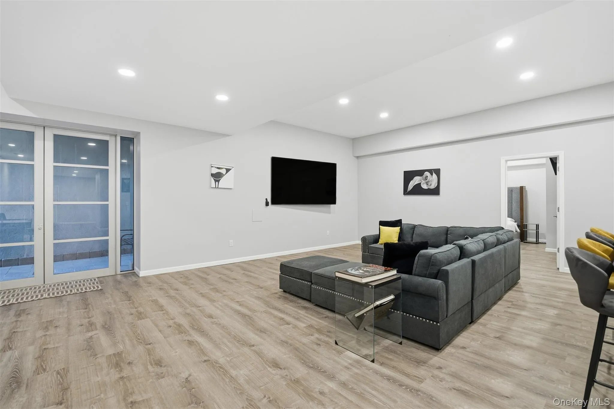 Living area featuring recessed lighting and light wood-type flooring Living area featuring recessed lighting and light wood-type flooring