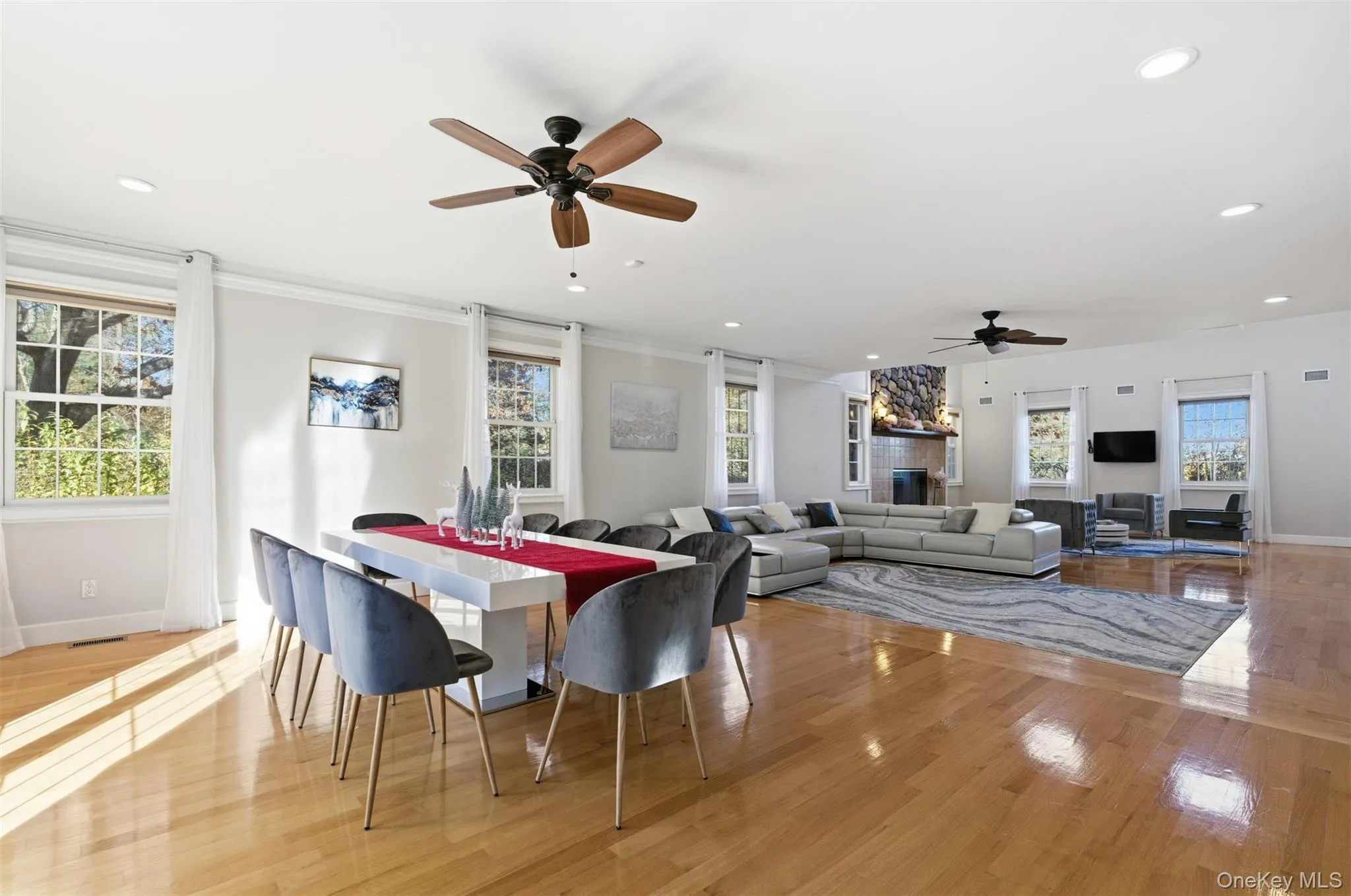 Dining space featuring ceiling fan, light wood-type flooring, recessed lighting, and crown molding Dining space featuring ceiling fan, light wood-type flooring, recessed lighting, and crown molding