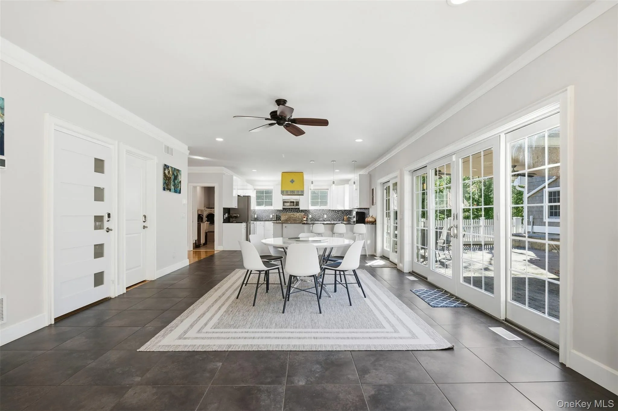 Dining area with crown molding, a ceiling fan, and recessed lighting Dining area with crown molding, a ceiling fan, and recessed lighting
