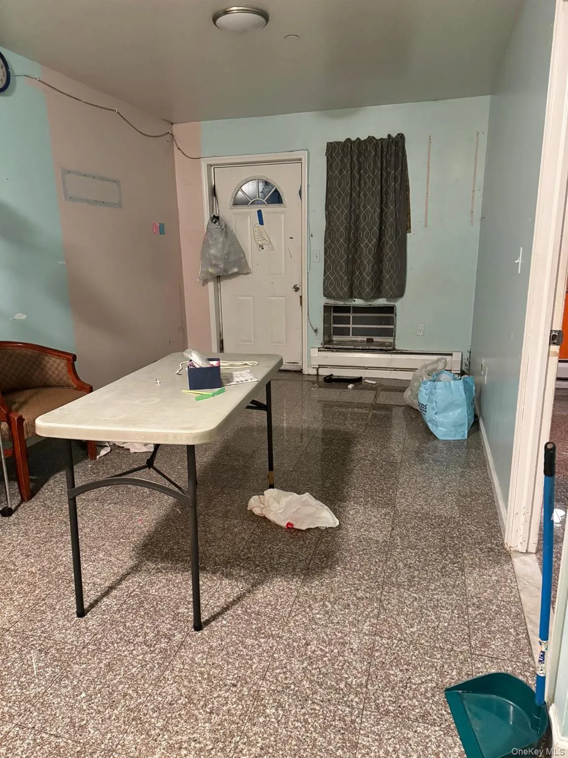 Dining area featuring granite floors and a baseboard heating unit Dining area featuring granite floors and a baseboard heating unit