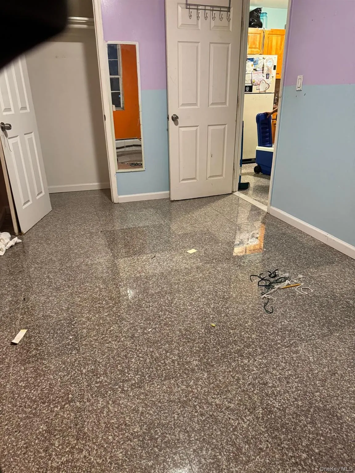 Unfurnished room featuring granite tiled floors and baseboards Unfurnished room featuring granite tiled floors and baseboards