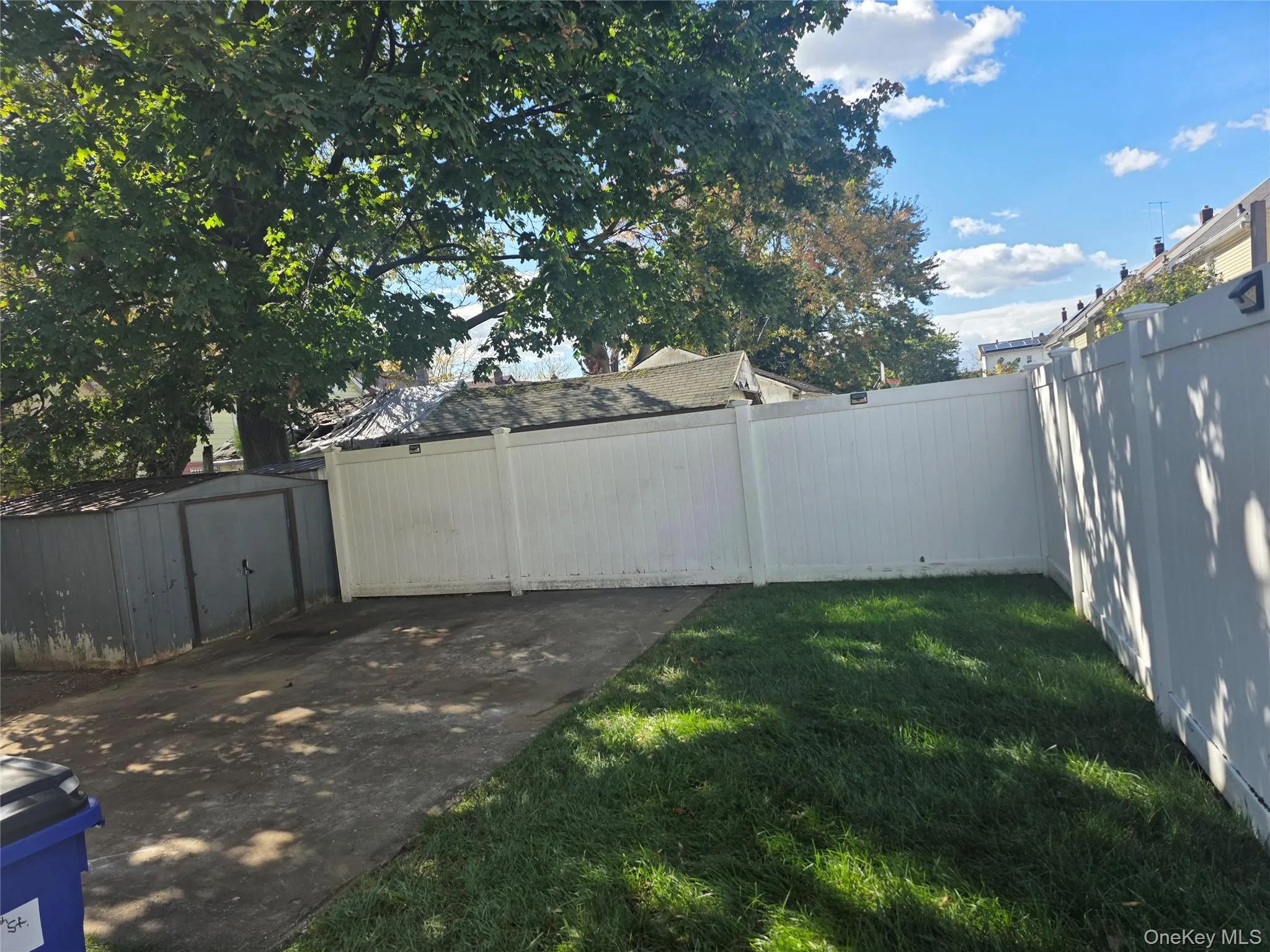 Fenced backyard with a shed Fenced backyard with a shed