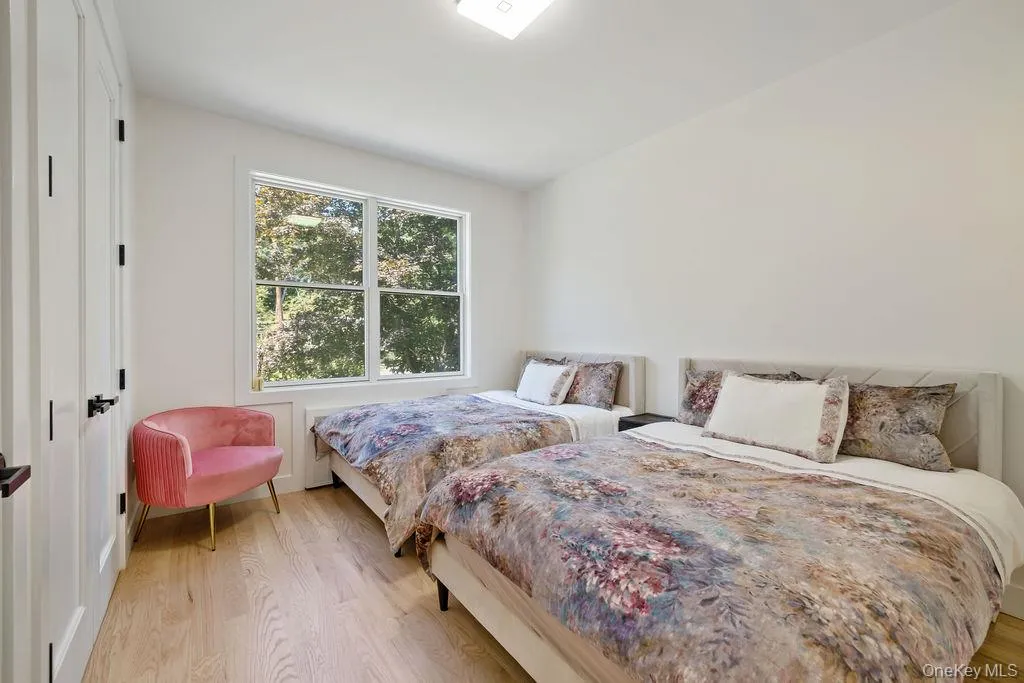 Bedroom featuring light wood finished floors Bedroom featuring light wood finished floors